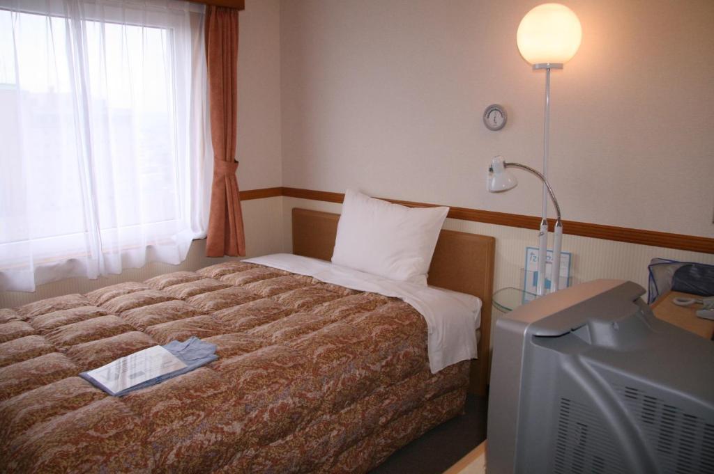 Toyoko Inn Hirosaki Ekimae חדר תמונה